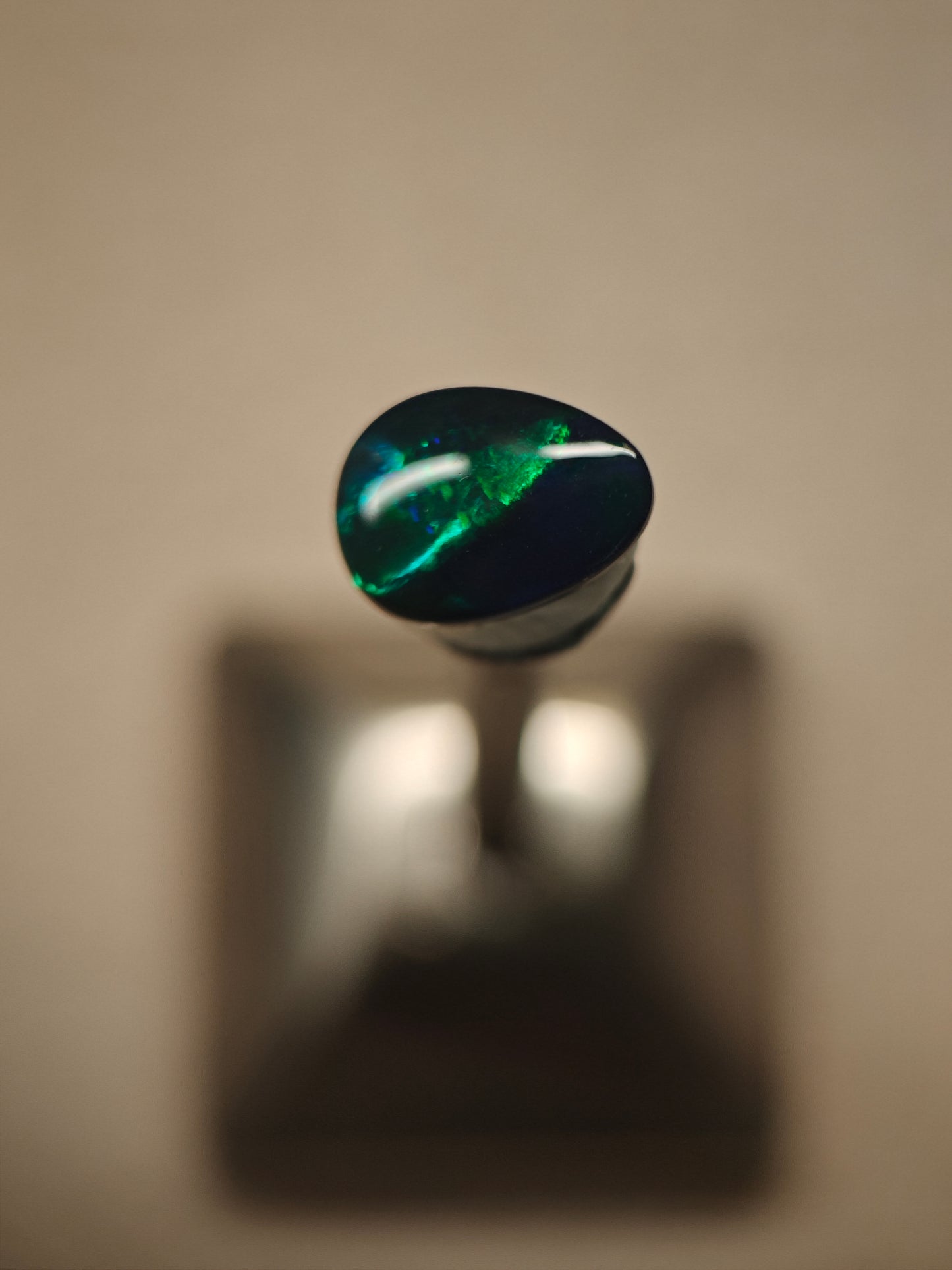 Australian black opal gem with metallic lighting