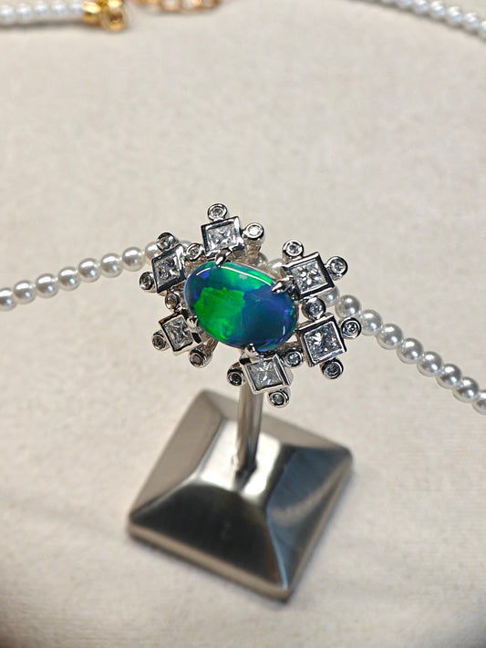 Australian black opal diamonds pendant with green and blue metallic lighting