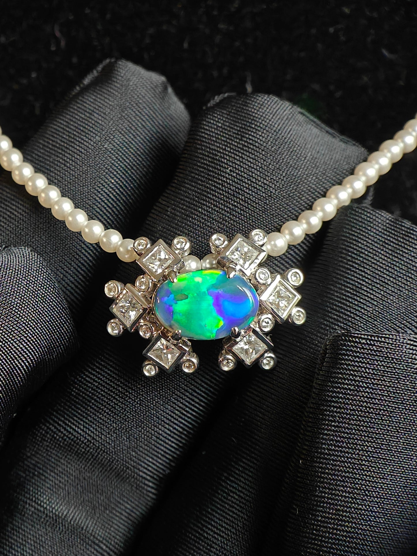 Australian black opal diamonds pendant with green and blue metallic lighting