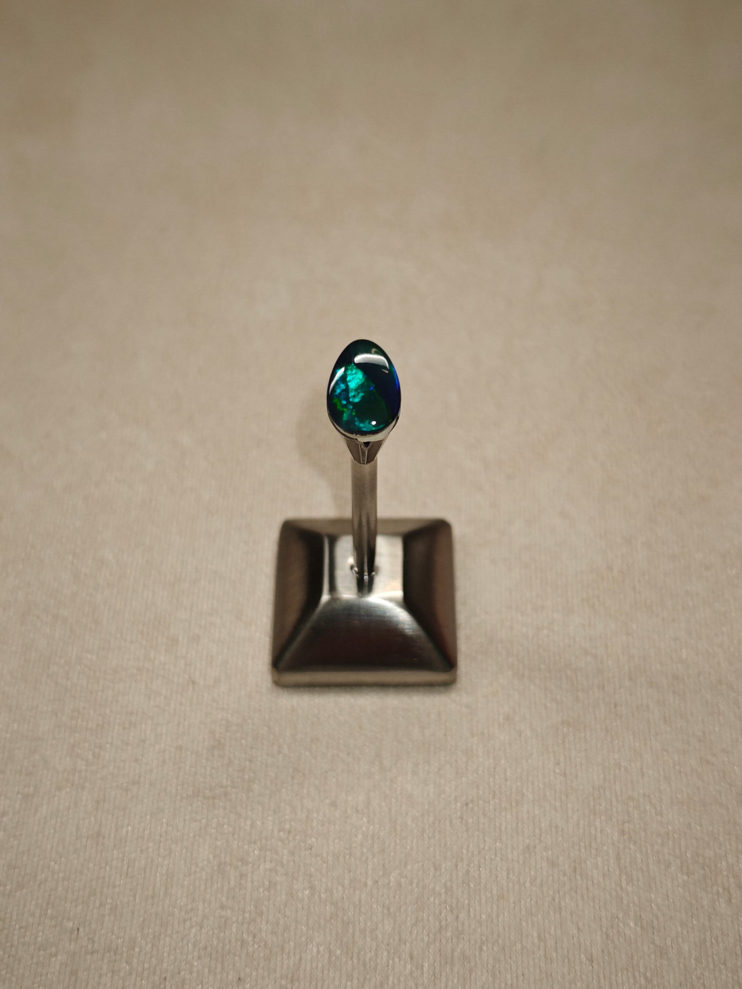 Australian black opal gem with metallic lighting 