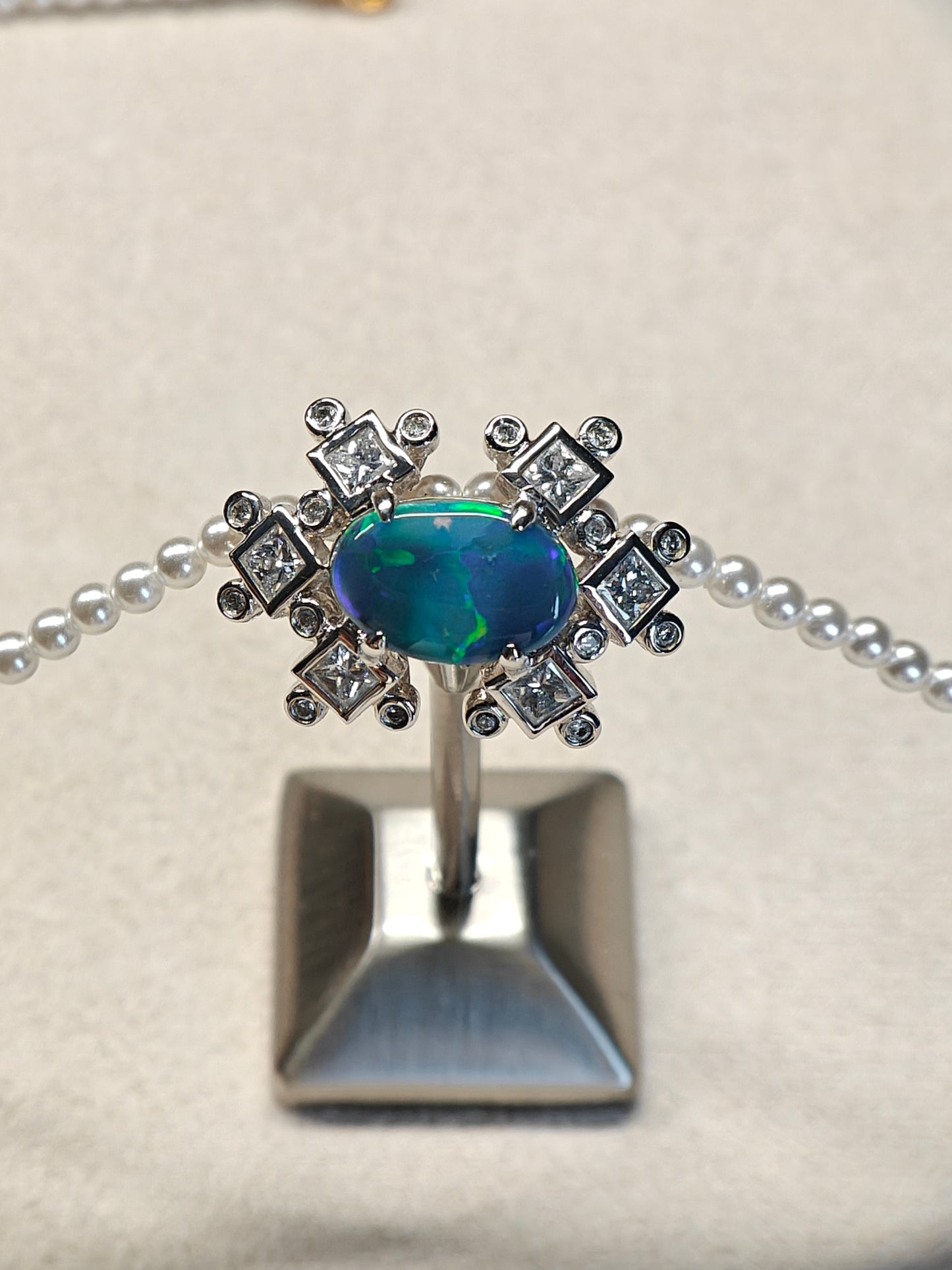 Australian black opal diamonds pendant with green and blue metallic lighting 