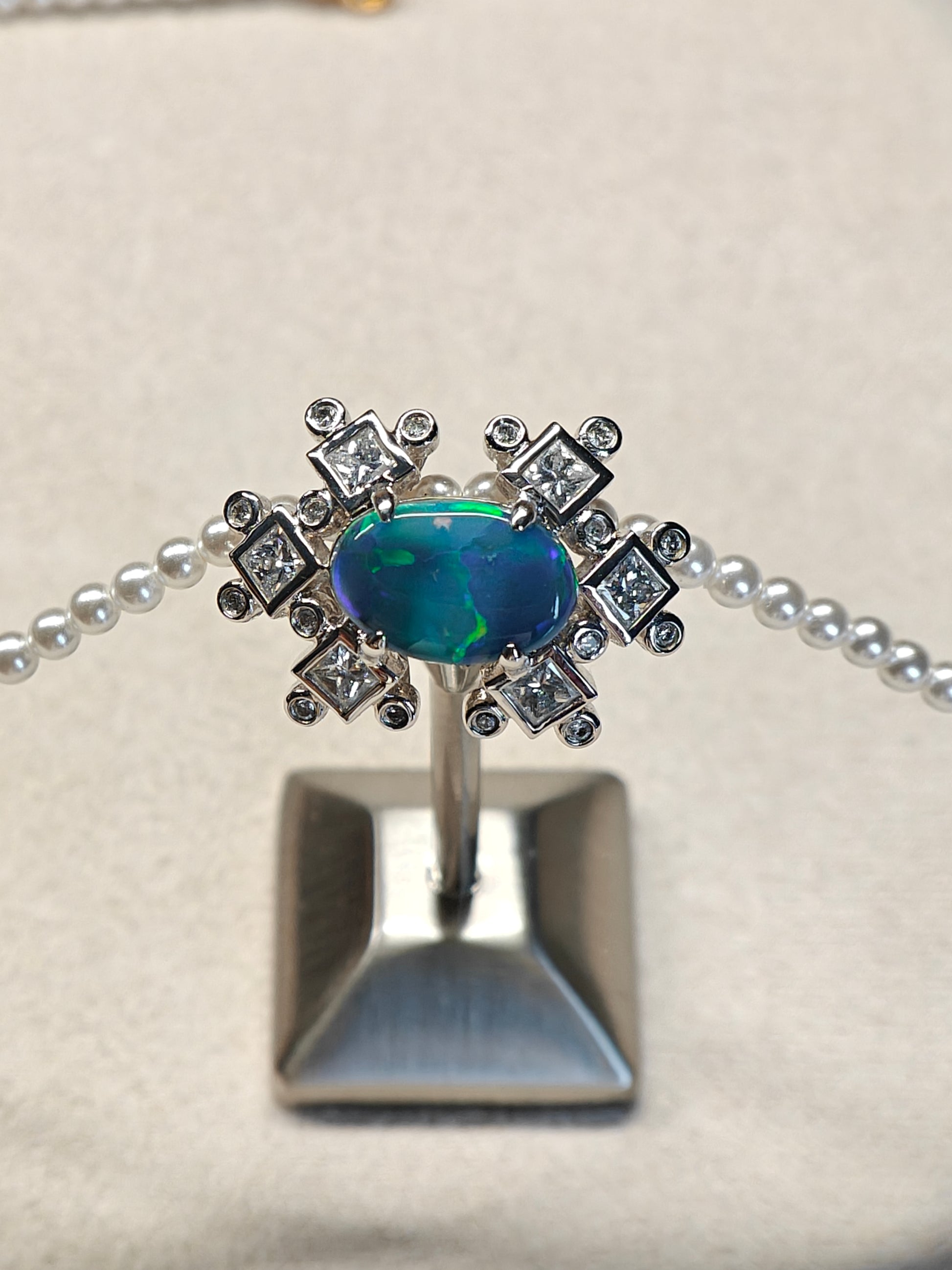 Australian black opal diamonds pendant with green and blue metallic lighting 