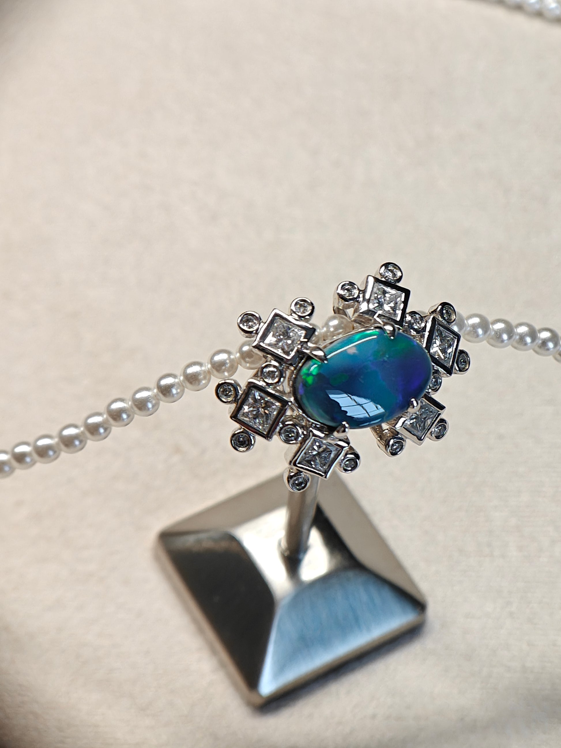 Australian black opal diamonds pendant with green and blue metallic lighting 