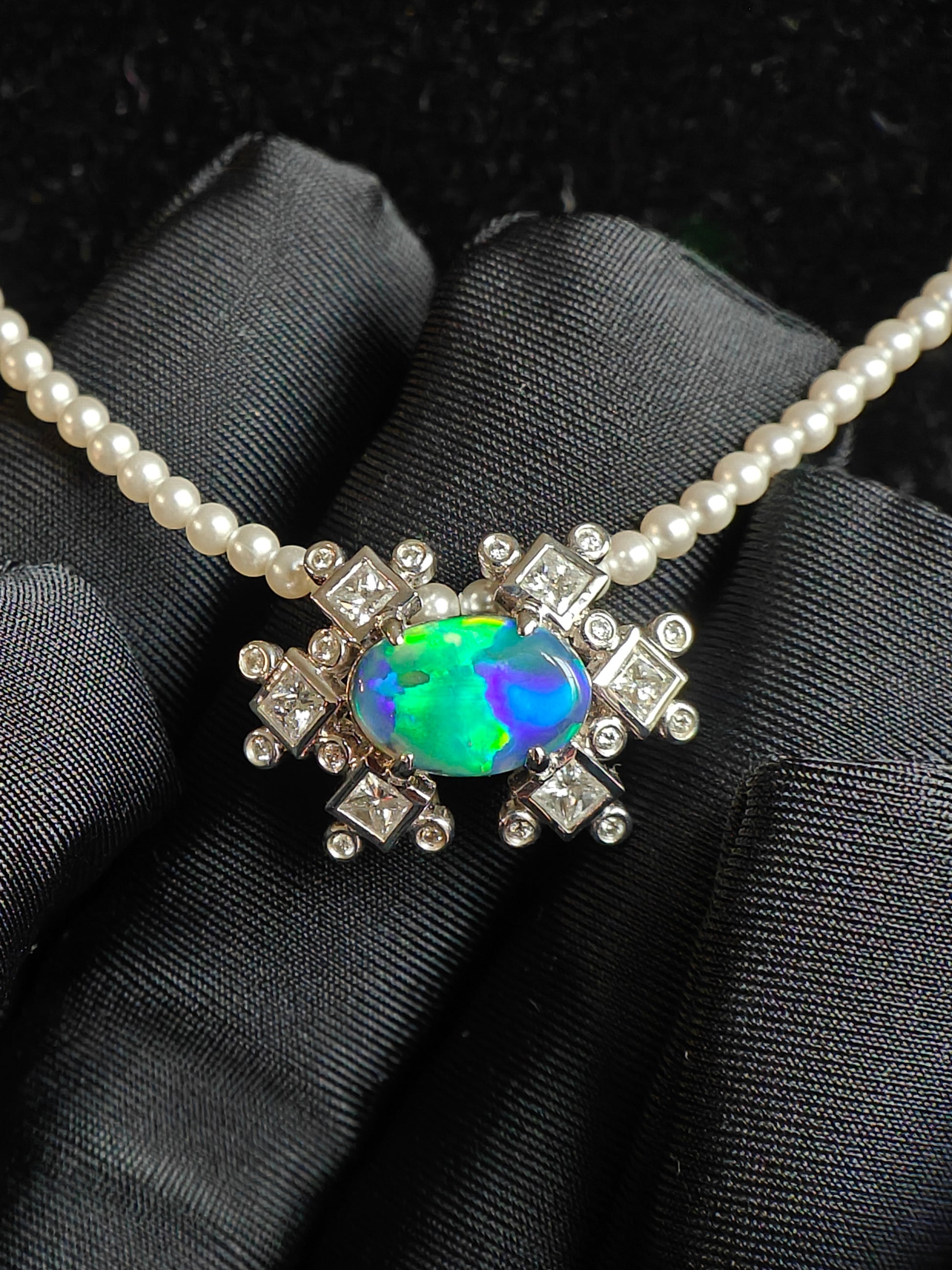 Australian black opal diamonds pendant with green and blue metallic lighting 