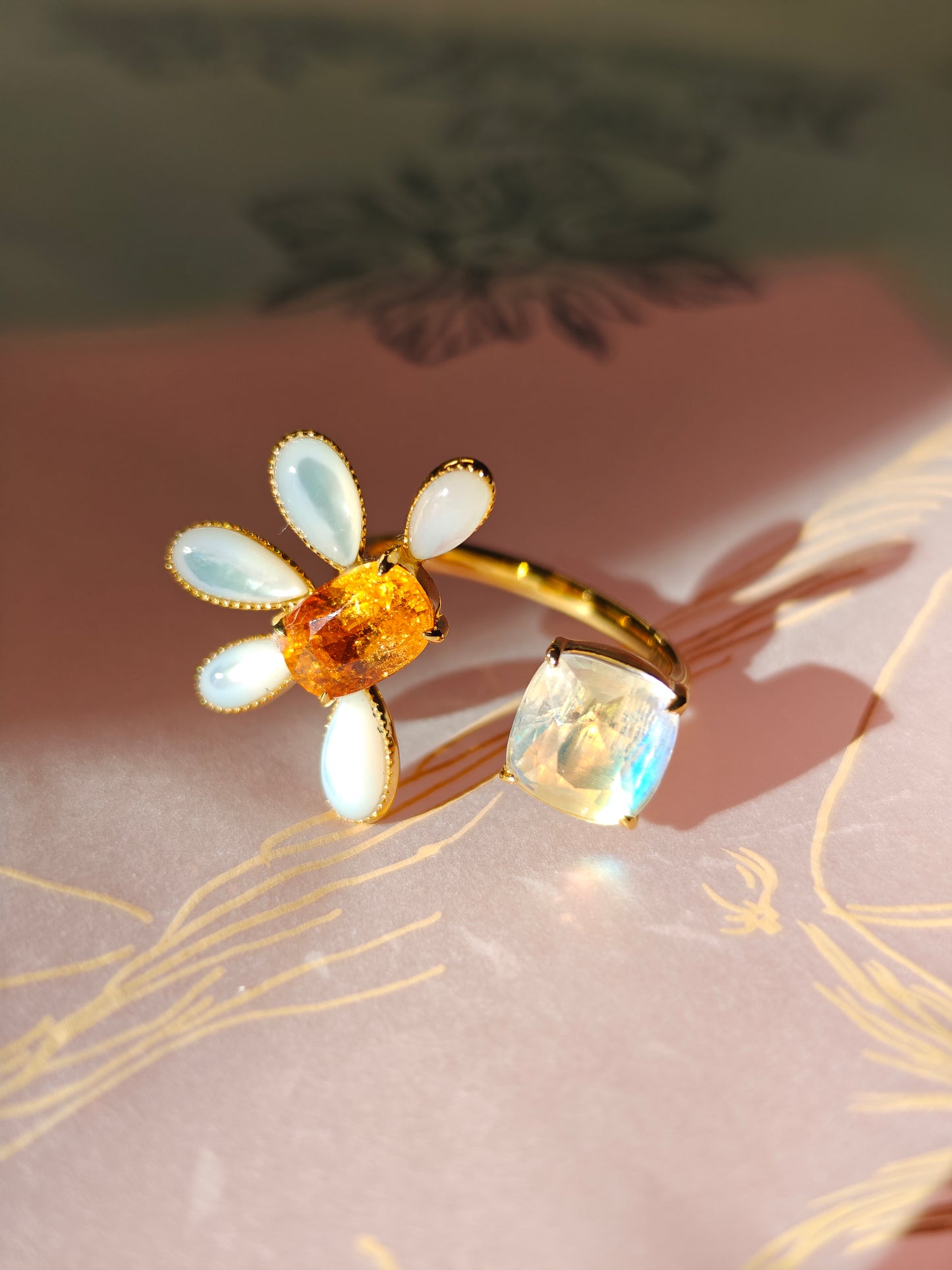 floral design 18k ring with spessartine moonstone and mother of pearl