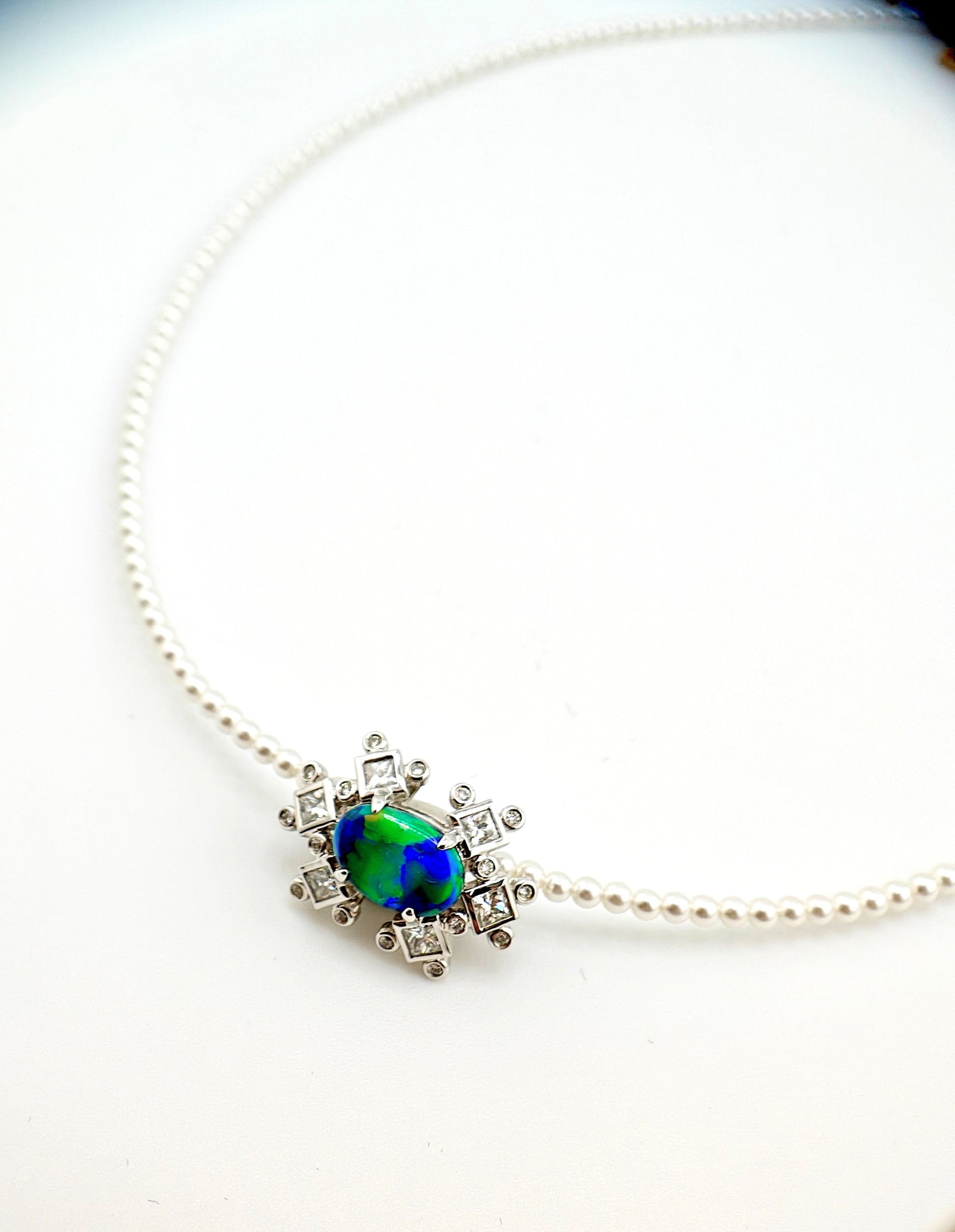 Australian black opal diamonds pendant with green and blue metallic lighting 