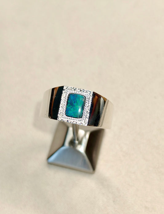 Male silver ring with a Australian black opal designed as a picture frame