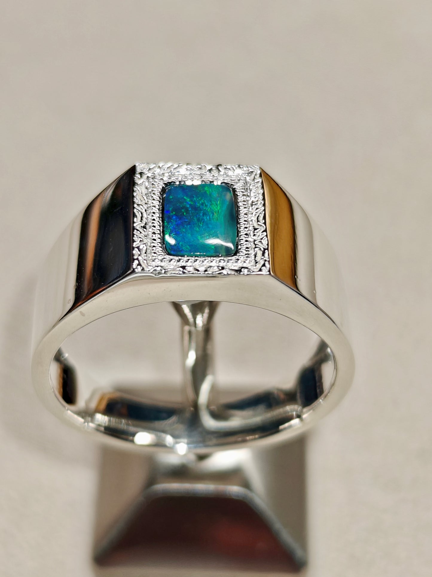 Male silver ring with a Australian black opal designed as a picture frame