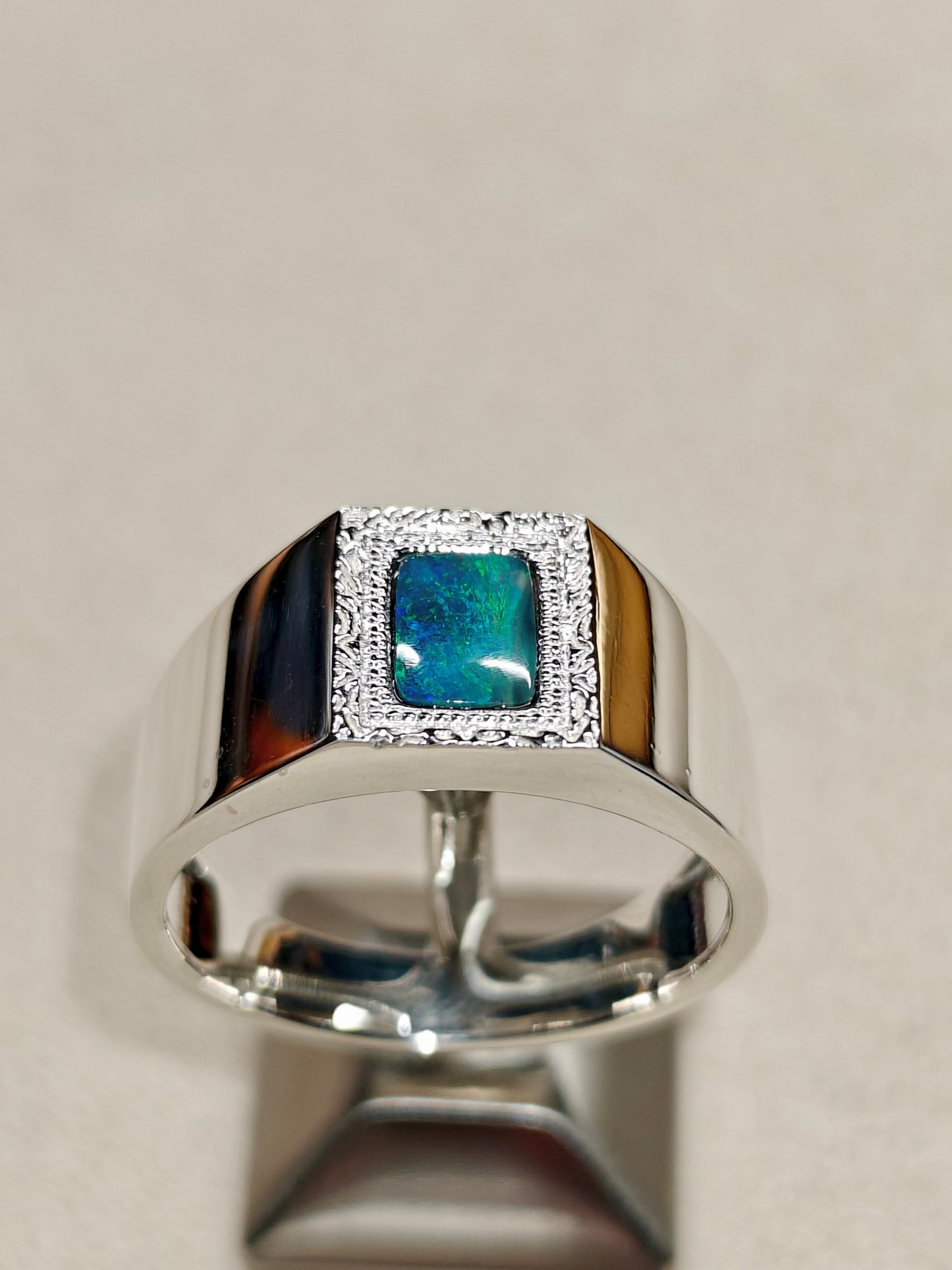 Male silver ring with a Australian black opal designed as a picture frame