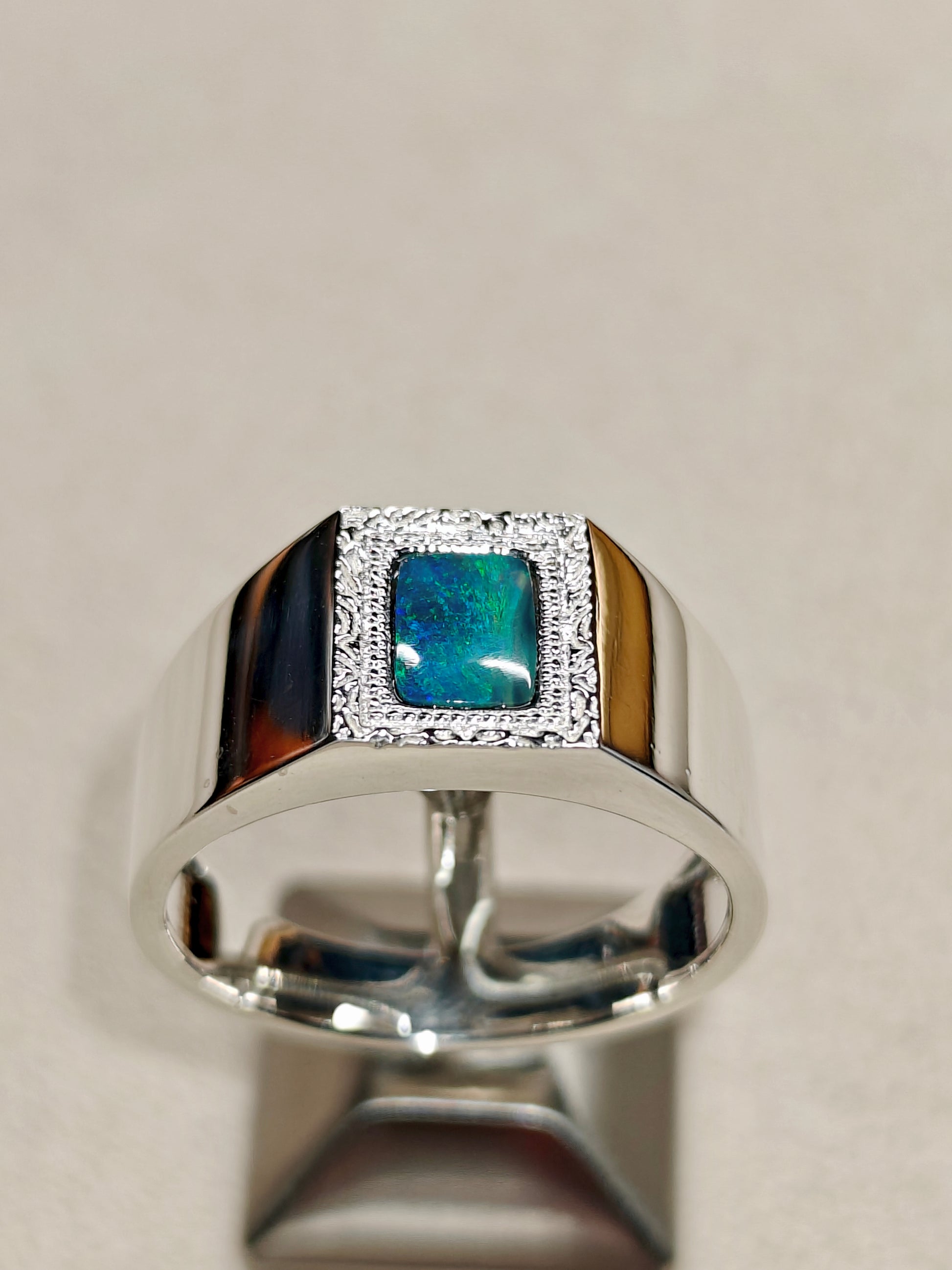 Male silver ring with a Australian black opal designed as a picture frame