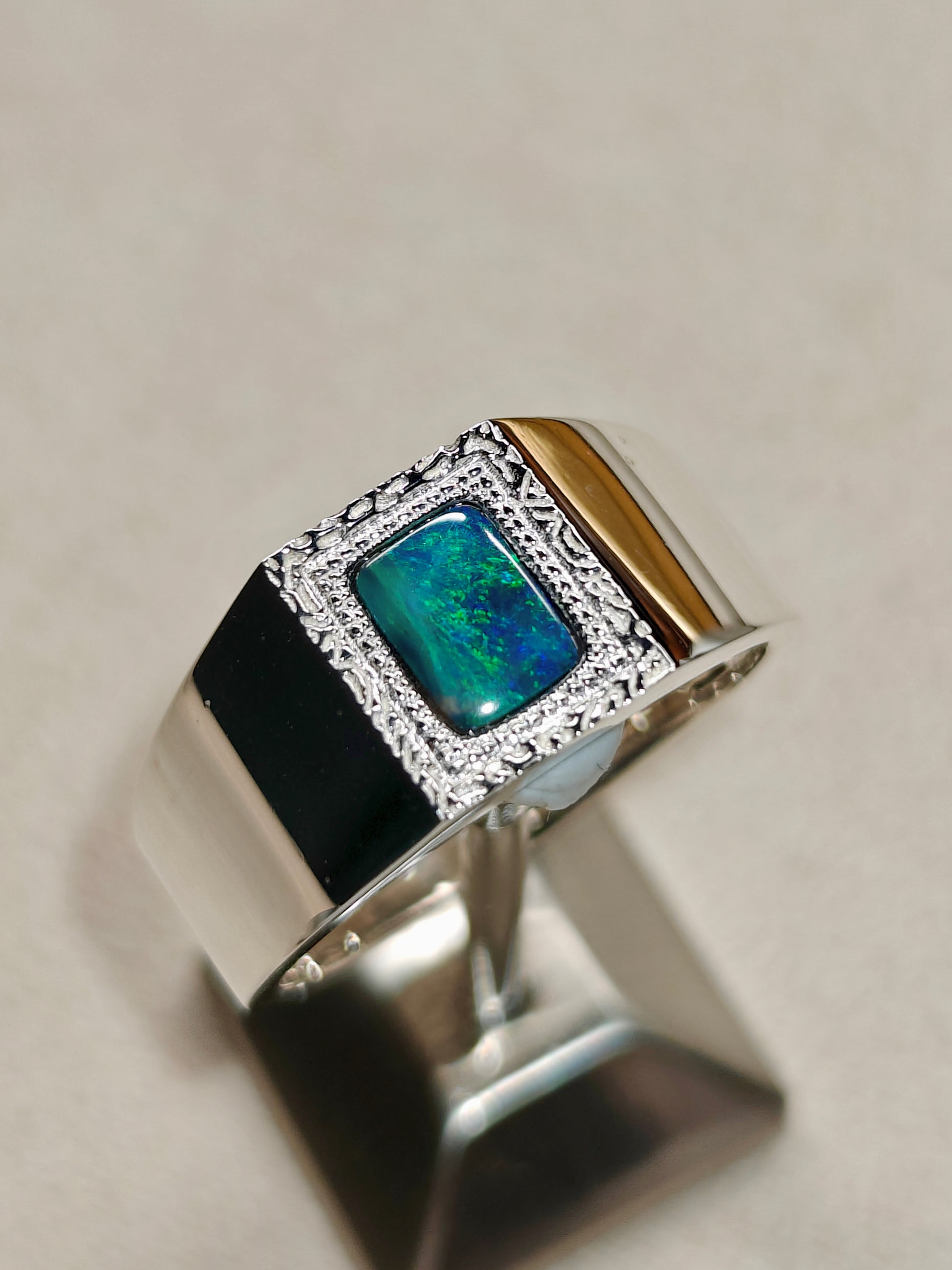 Male silver ring with a Australian black opal designed as a picture frame