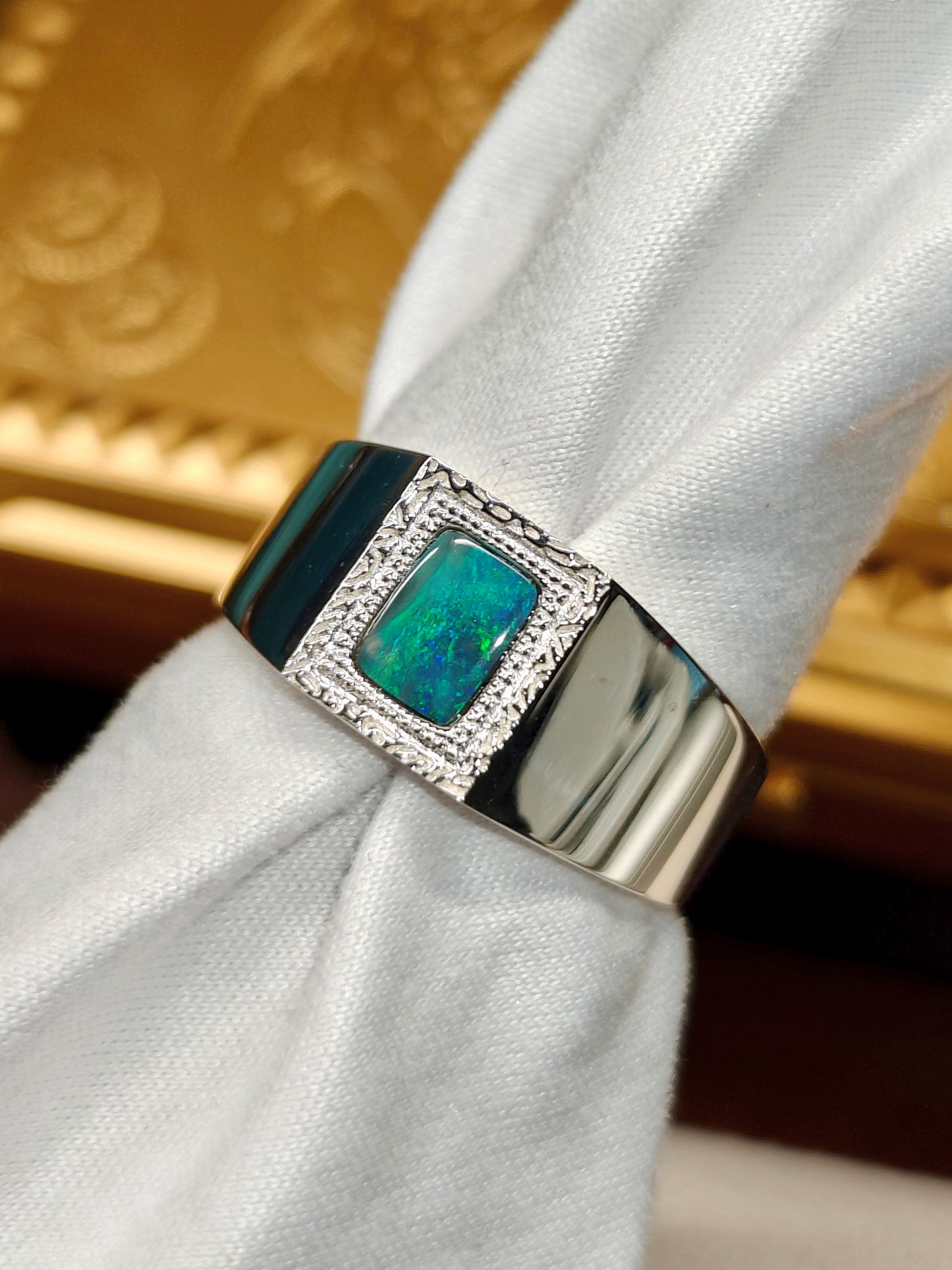Male silver ring with a Australian black opal designed as a picture frame